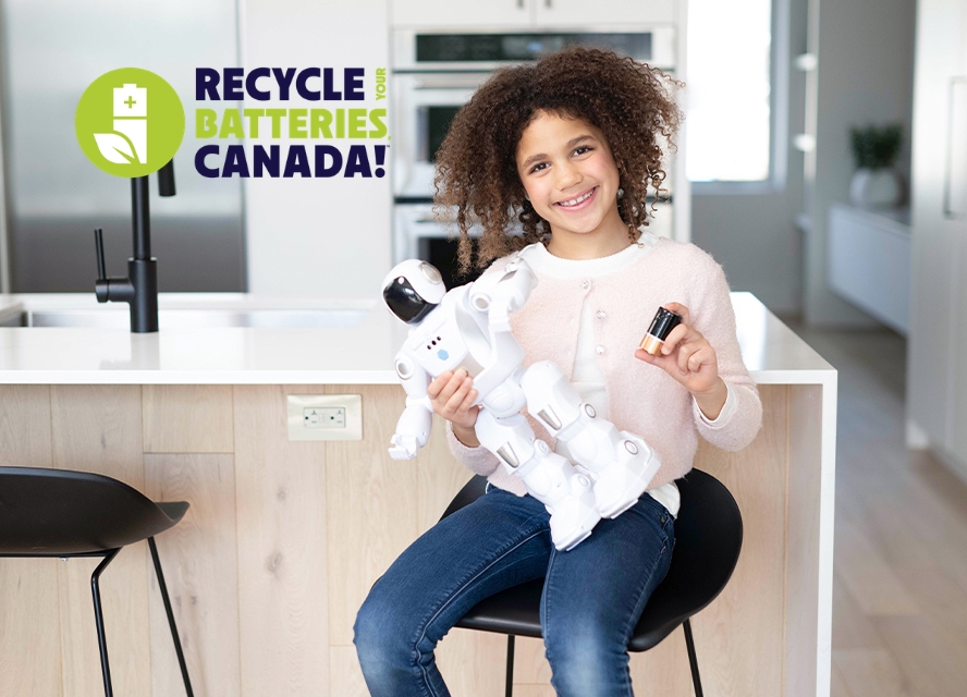 Kid recycling her used batteries