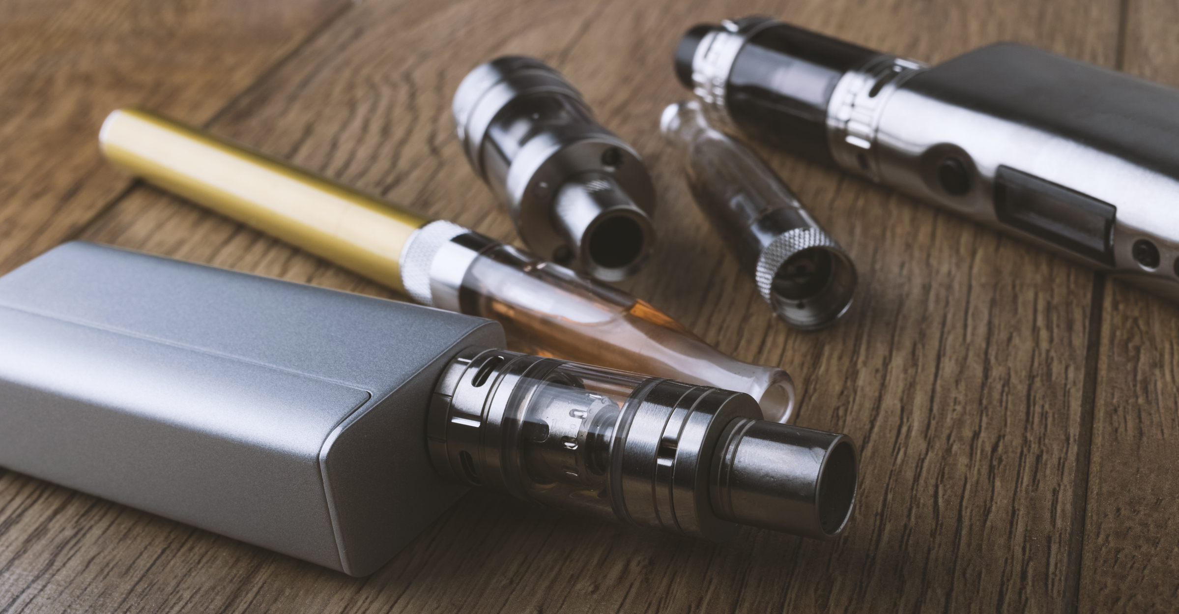 vape pen, mod, e cigarette, e-cig, on a wooden background.